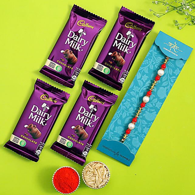 Buy/Send Pearl Rakhi With Four Dairy Milk Chocolates Online- FNP Buy/Send Pearl Rakhi With Four Dairy Milk Chocolates Online- FNP
